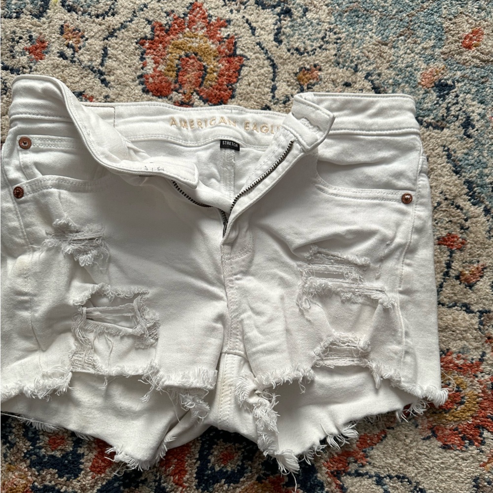 White ripped American Eagle shorts